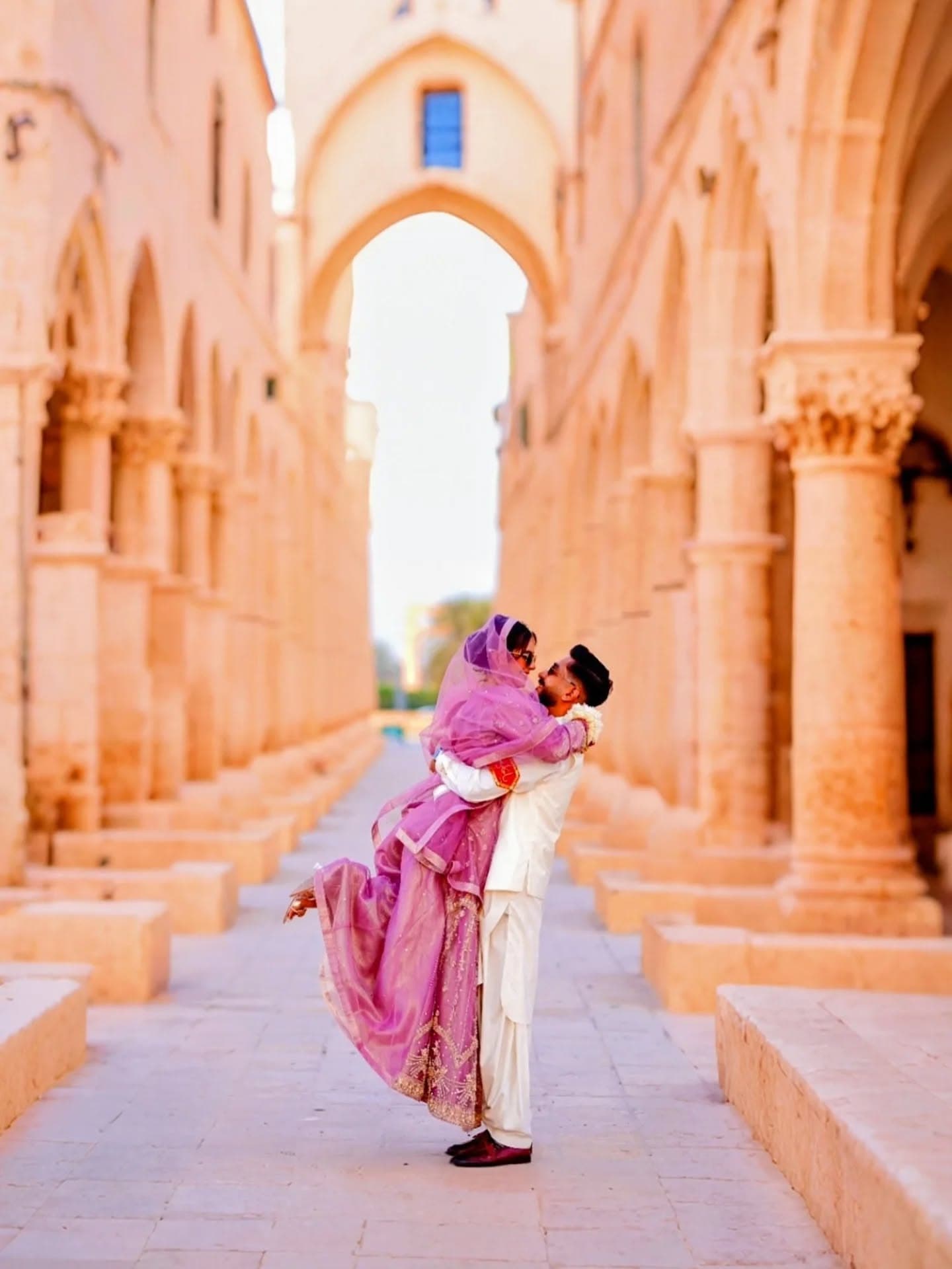 Bride and groom sharing an intimate moment during a golden-hour portrait session