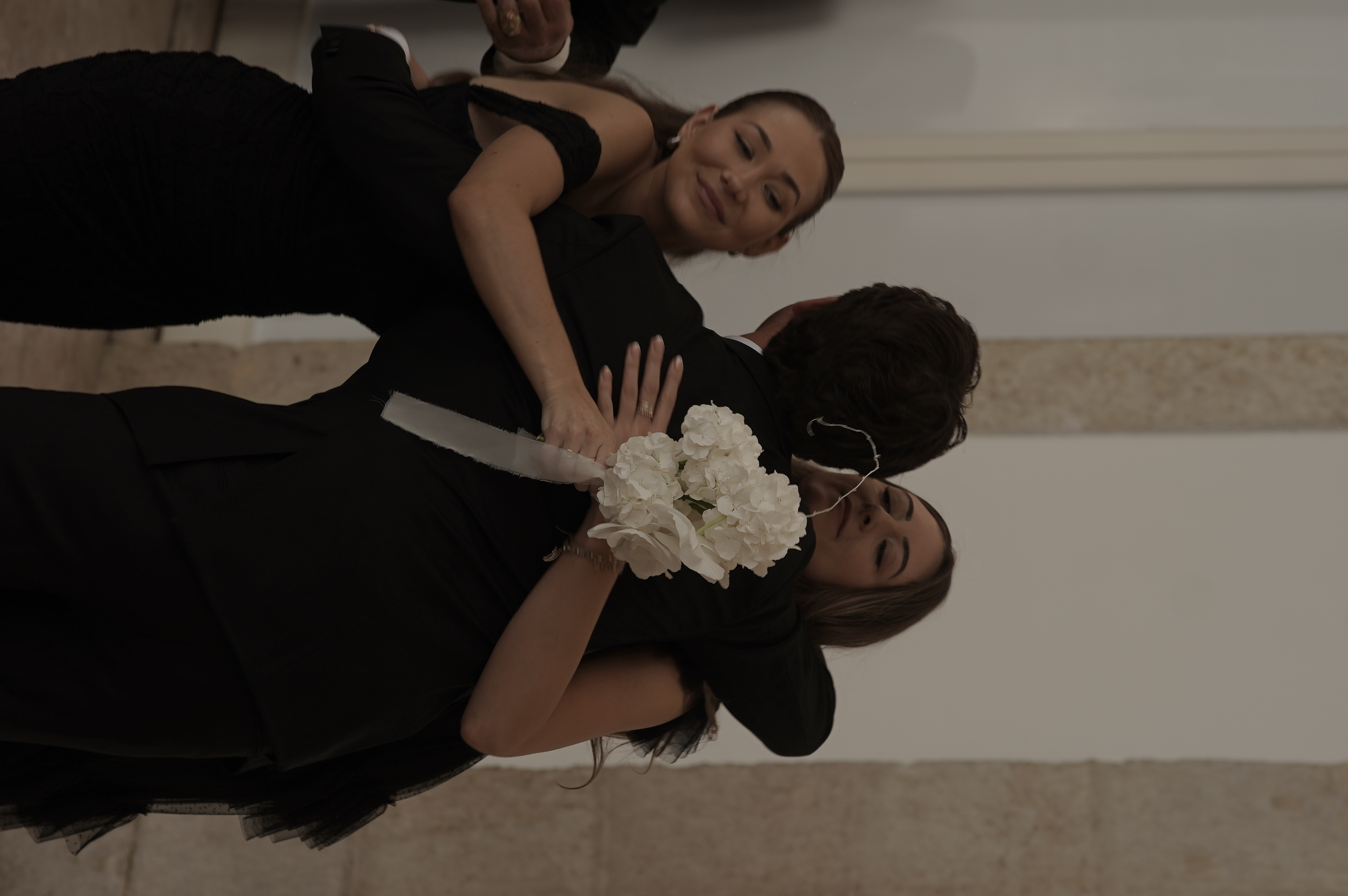 Elegant destination wedding couple walking through palace gardens in Portugal